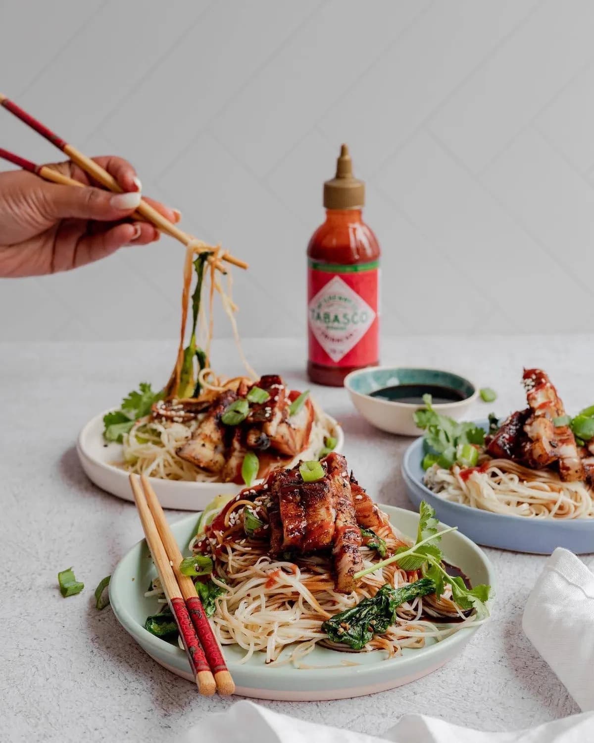 Three plated stir-fry dishes created during Tabasco recipe development.