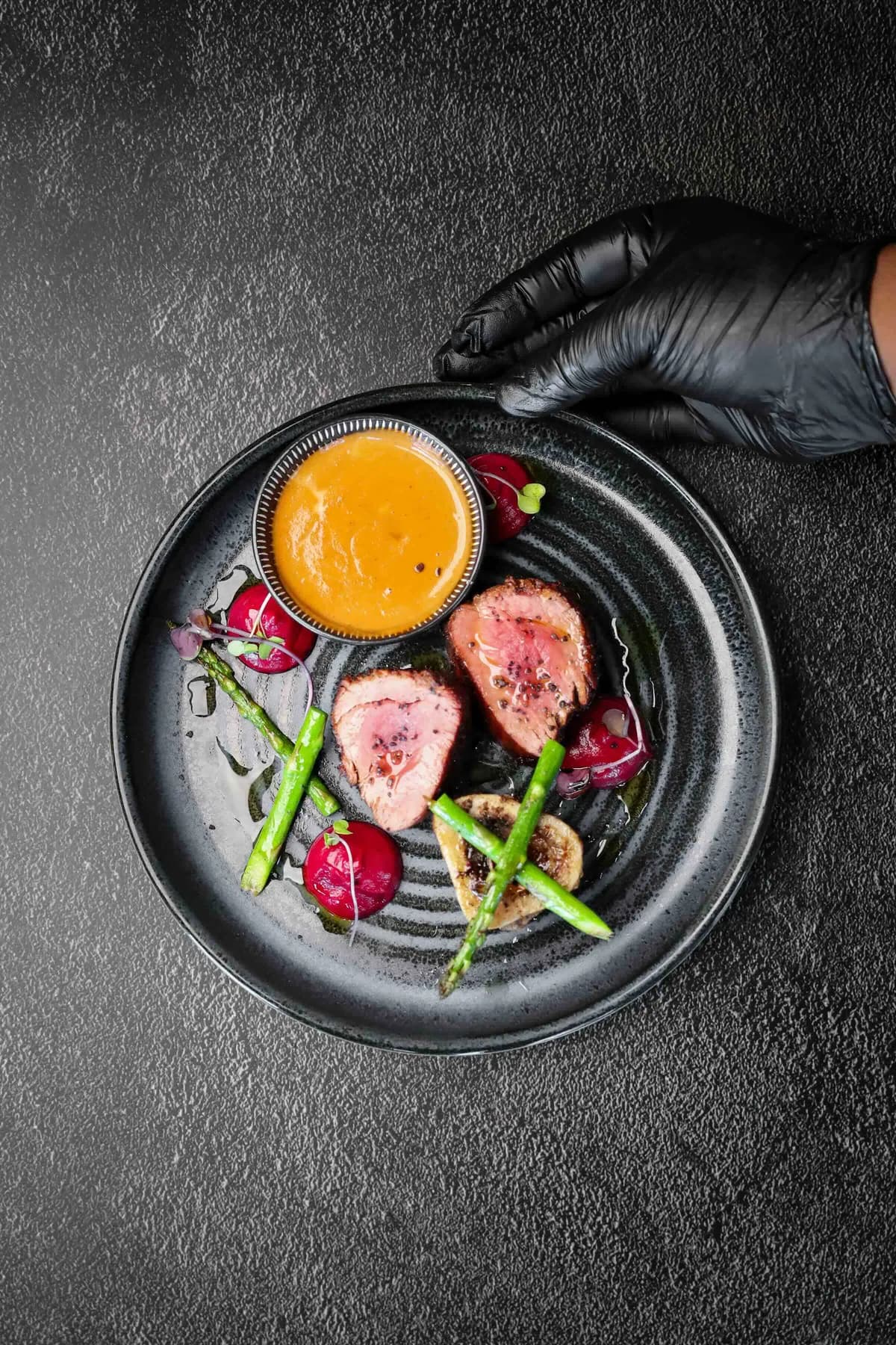 King’s Kraal restaurant dishes photographed from above against a black background