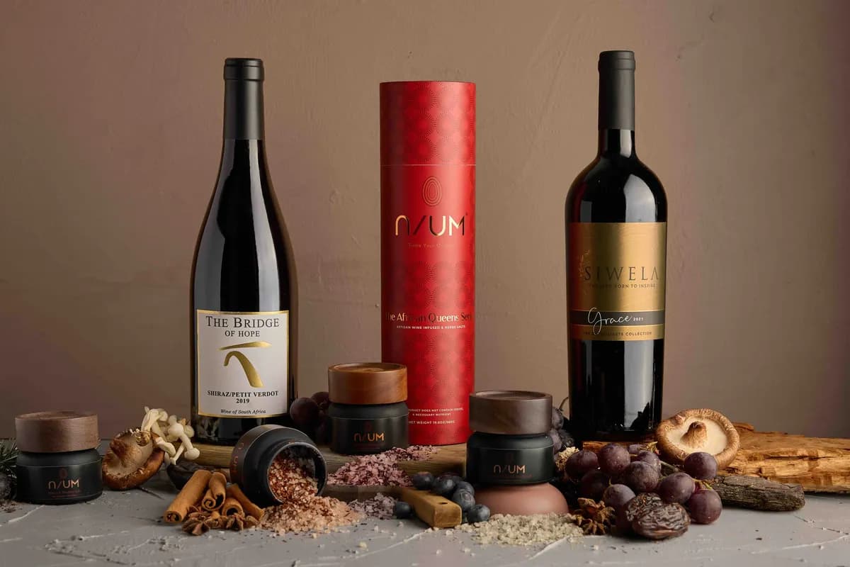 Assorted South African wines and artisanal salt blends styled for a food and wine shoot.